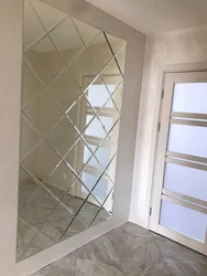 Kitchen design with mirror tiles on the wall