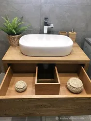 Photo Of A Bathtub With A Sink And A Bedside Table In The Bathroom