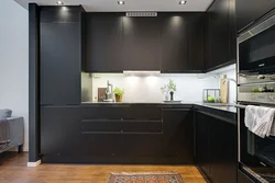 Photo of a kitchen with a black refrigerator photo