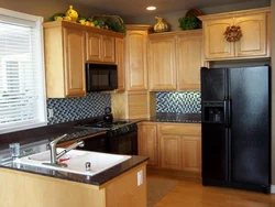 Photo of a kitchen with a black refrigerator photo