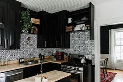 Photo Of A Kitchen With A Black Refrigerator Photo