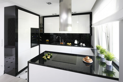 Photo Of A Kitchen With A Black Refrigerator Photo