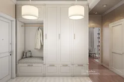 Sliding wardrobe in the hallway design white