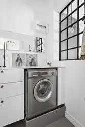 Gray washing machine in the bathroom interior