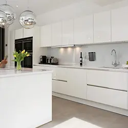 Glossy kitchen in a modern style photo white