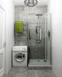 Photo of a bath with shower, sink and washing machine