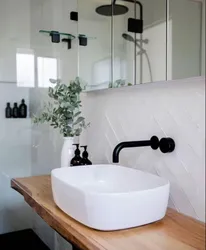 Black plumbing in the bathroom photo