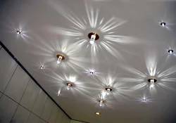 How to place lamps on a suspended ceiling photo in the bedroom