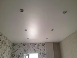 How to place lamps on a suspended ceiling photo in the bedroom