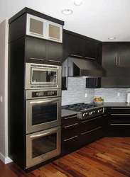 Photos of corner kitchens with built-in appliances and counter