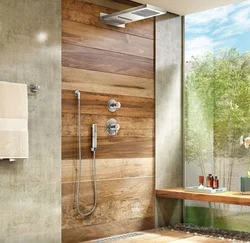 Photo of a bathtub made of concrete and wood tiles