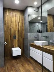 Photo Of A Bathtub Made Of Concrete And Wood Tiles