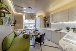 Interior of a rectangular kitchen with a sofa photo