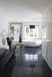 Black floor in the bathroom interior photo