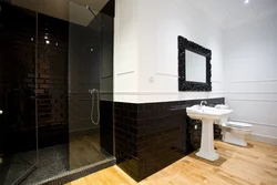 Black floor in the bathroom interior photo