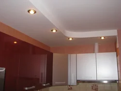 Photo of two-level plasterboard ceilings in the kitchen with lighting