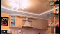 Photo of two-level plasterboard ceilings in the kitchen with lighting