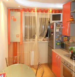 Оранжевая кухня в интерьере фото с какими шторами