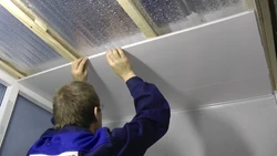 Step-by-step photo of a bathroom ceiling made of plastic panels