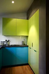 Green kitchen with blue photo