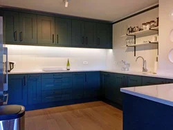 Green kitchen with blue photo