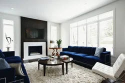 White sofas in the interior of the living room photo in a city apartment