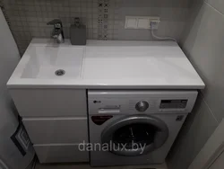 Install a washing machine in the bathroom under the sink photo