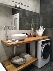 Install a washing machine in the bathroom under the sink photo