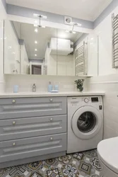 Bath interior with washing machine and countertop