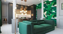 Emerald sofa in the interior of the kitchen living room