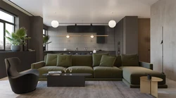 Emerald sofa in the interior of the kitchen living room