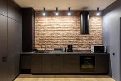 Wallpaper brick in the kitchen photo in the interior