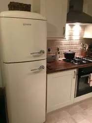 Kitchen design with beige refrigerator