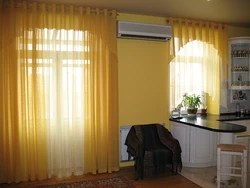 Interior of curtains in the kitchen with two windows