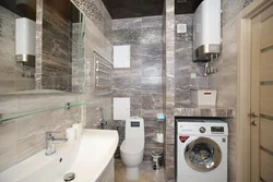 Bathroom interior with shower and toilet, washing machine