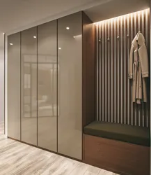 Design of a narrow hallway with a wardrobe in a modern style