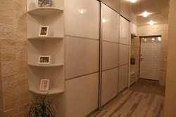 Design of a narrow hallway with a wardrobe in a modern style