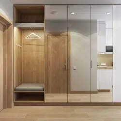 Design of a narrow hallway with a wardrobe in a modern style