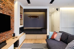 Studio apartment with a niche interior design photo