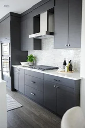 Light gray kitchen with dark countertop photo