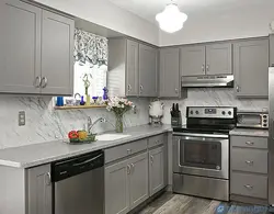 Light gray kitchen with dark countertop photo