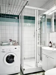 Bathroom In Khrushchev With A Shower And Washing Machine Photo