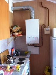 Gas boiler in the kitchen at home photo