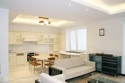 Design of suspended ceilings in the living room combined with the kitchen in the house