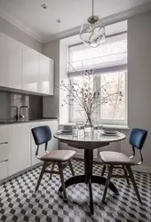 Round Table In The Interior Of A Small Kitchen