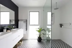 White and black bathrooms with shower photo