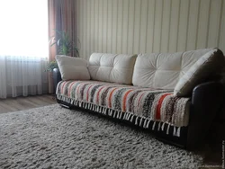 Blanket on the sofa in the living room interior photo
