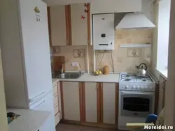 Kitchen design 6 m2 with refrigerator and geyser photo