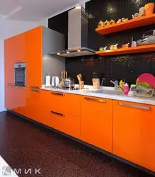 Orange kitchen set in the kitchen interior