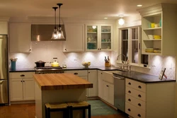 Lamps in a small kitchen interior photo